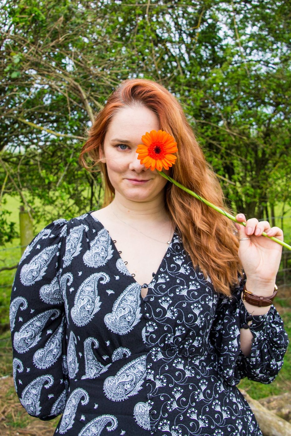 Hannah Collins holding a gerbera